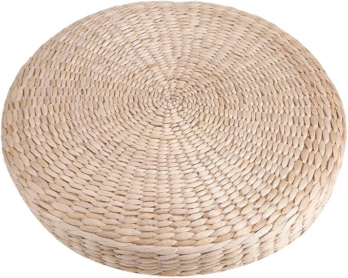 A round, light beige, woven straw mat.